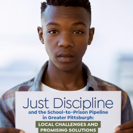 boy holding Just Discipline sign