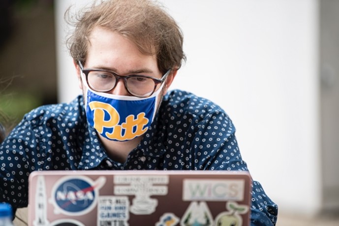 Pitt student wearing a mask