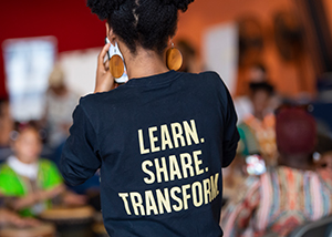 girl with learn share transform words on her shirt