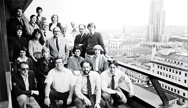 LRDC researchers posing on balcony of LRDC building decades ago