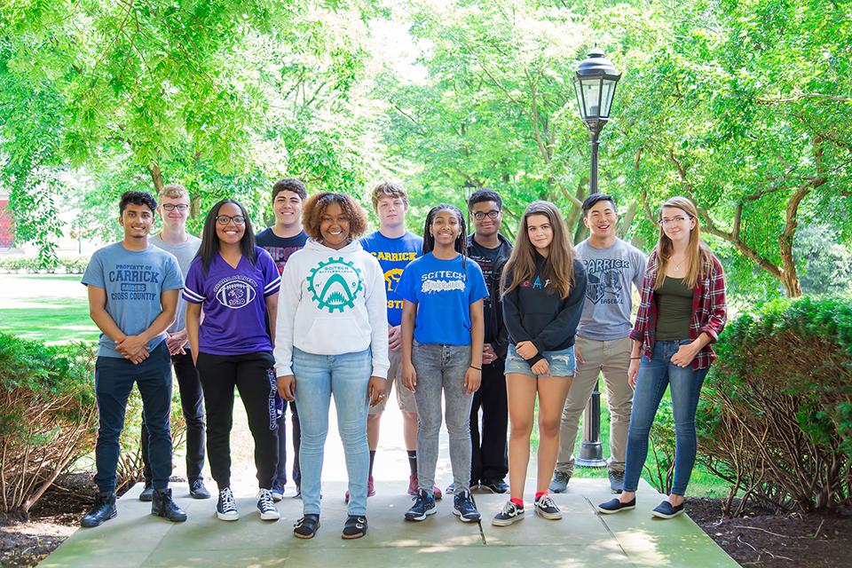 high school students posing on Pitt campus