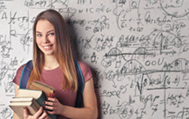 girl holding books in front of whiteboard
