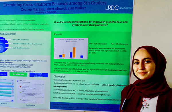 student with research poster